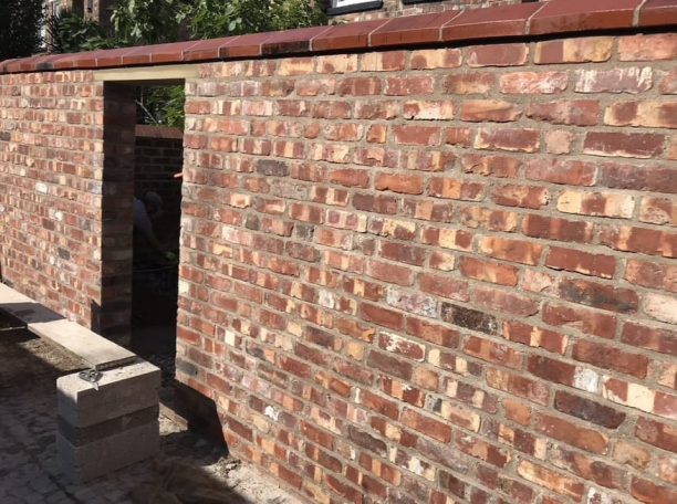 Reclaimed brick boundary wall built near Calderstones
