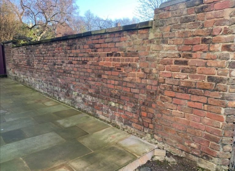 Brickwall before restoration in Grassendale