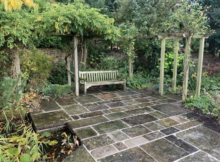 Traditional landscaped garden with yorkstone patio near Orrell