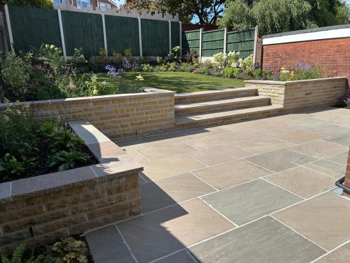 Natural sandstone patio paving in Ashton In Makerfield designed and built by Dempsey Heritage