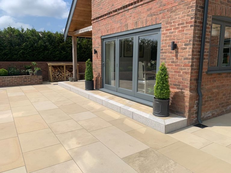 Garden landscape featuring a natural stone patio in Liverpool